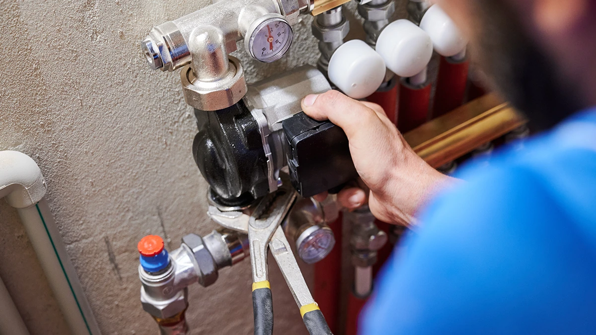 Gas Safe Engineer Repairing A Leak.
